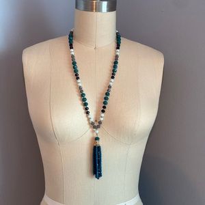 Blue beaded necklace with tassel detail